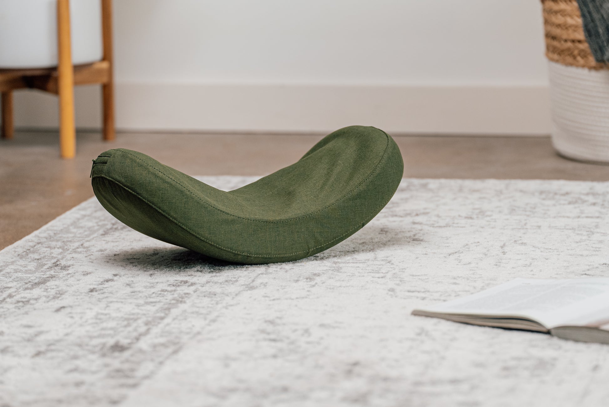 Image of the HALO Lumbar Stretch Massage Cushion in a home environment. 